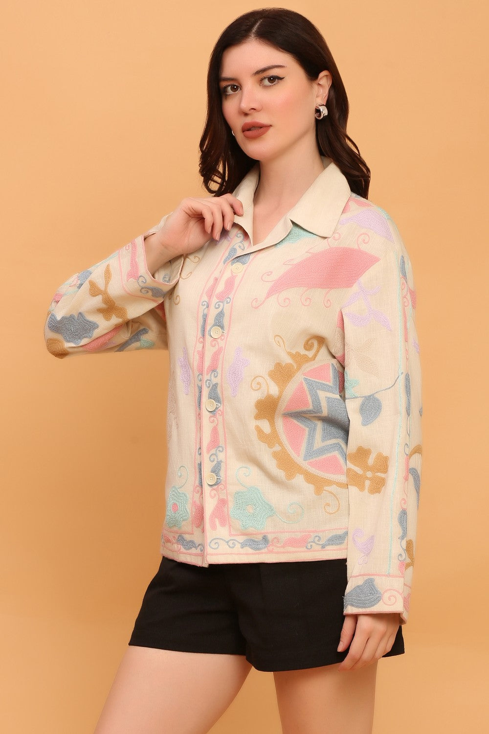 “All-over Suzani embroidery and chain stitches on a unisex organic cotton shirt” 