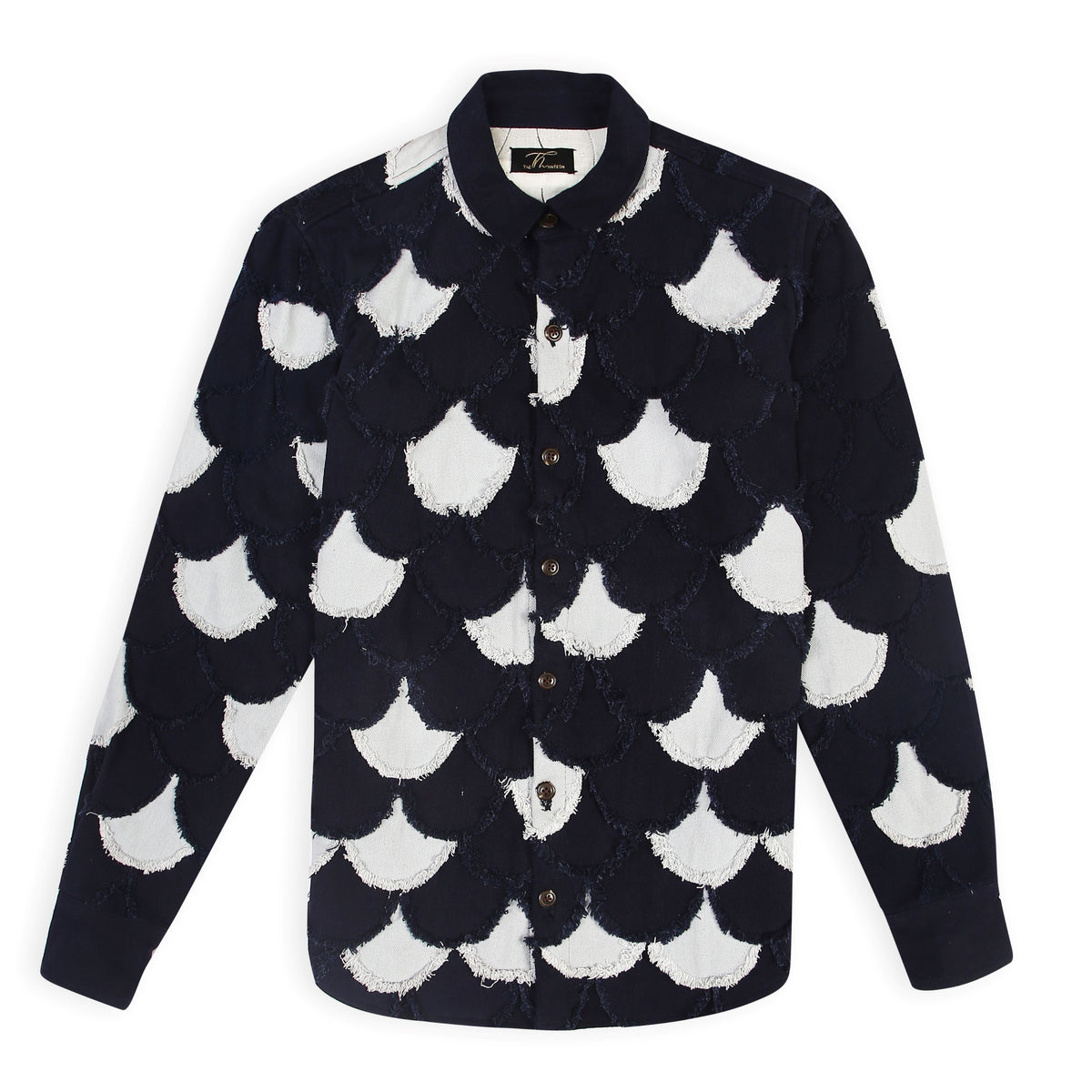 A navy and light blue denim jacket with scalloped patchwork pattern and eyelash fringe detailing.
