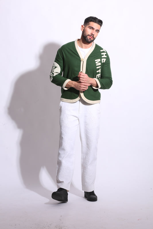 Person wearing a green and white jacket on a white background