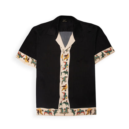 A black shirt with a vibrant bird of paradise pattern on the collar and sleeves, displayed against a white background.