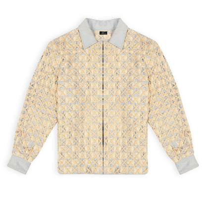 A beige and blue denim twill coach jacket with hand weaving technique and front hook closures, featuring a geometric pattern.