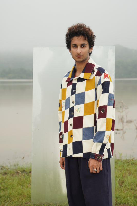 Jackson gender-fluid multicolor patchwork wool shacket with appliqué embroidery 
“Chic unisex patchwork embroidered wool jacket in multicolor panels” 