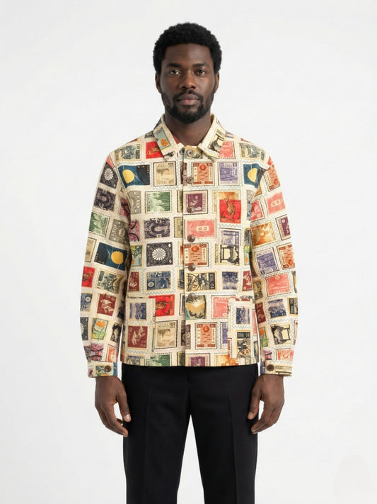 Man wearing a colorful patterned shirt on a white background