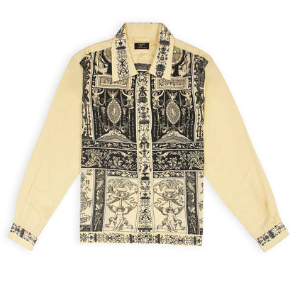 A long-sleeved yellow silk shirt with vintage retro print patterns.