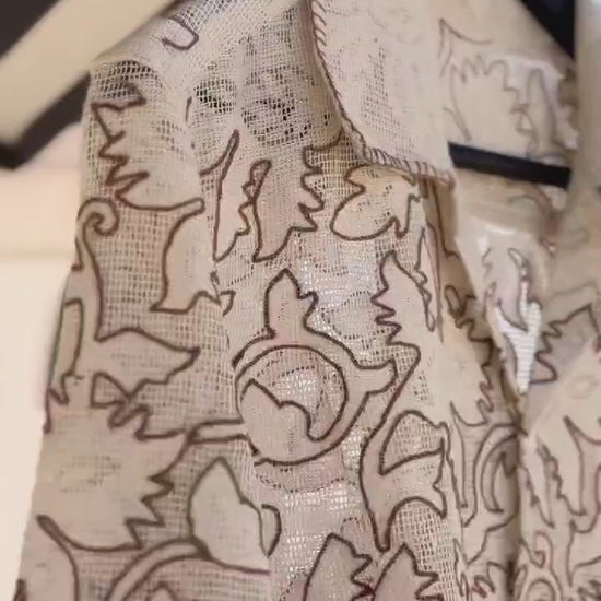 “Beige embroidered textured weave shirt with intricate chain stitch work” 